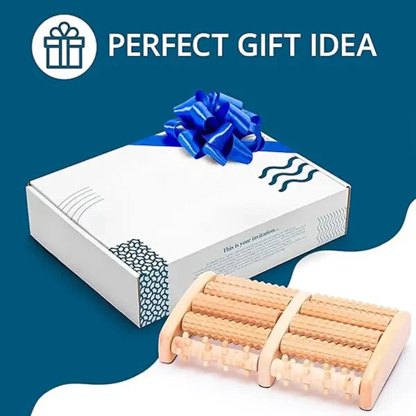 A dual wooden foot massager roller placed next to its white branded gift box with a blue ribbon, available for delivery in Pakistan.